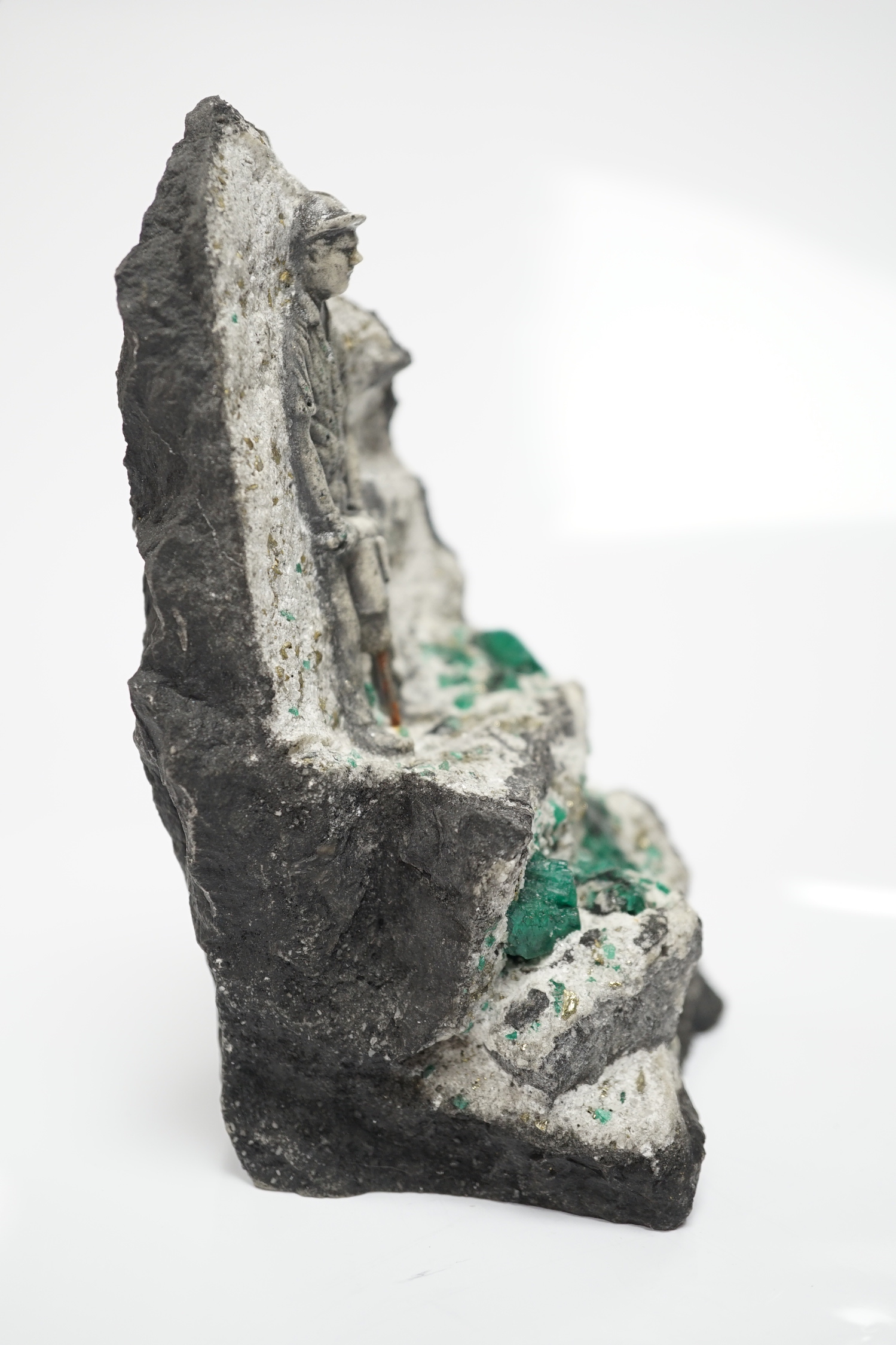 An iron pyrites and emerald? crystal figural geode sculpture, 14cm